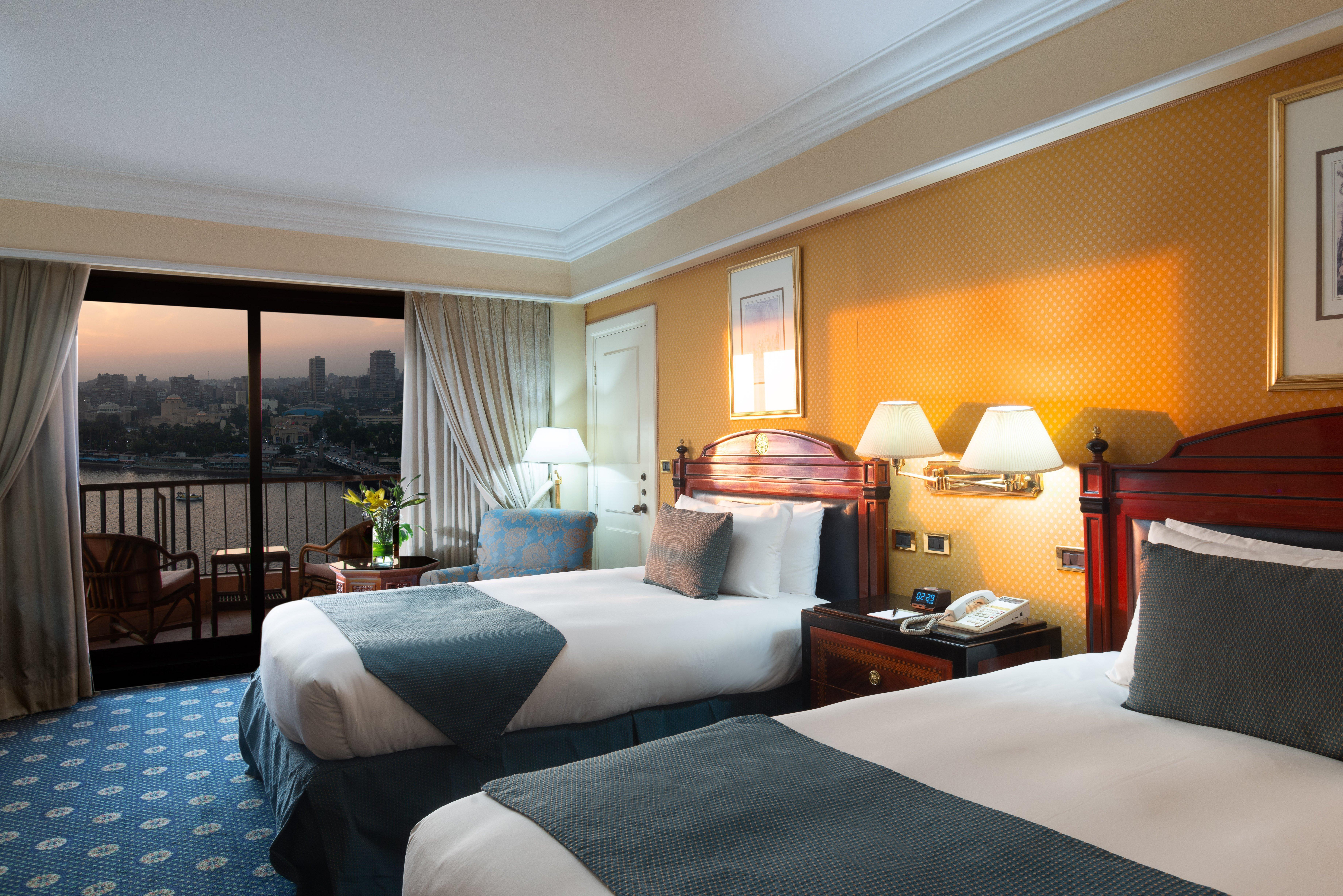 Intercontinental Cairo Semiramis By Ihg Hotel Kültér fotó A room at the Nile Ritz-Carlton