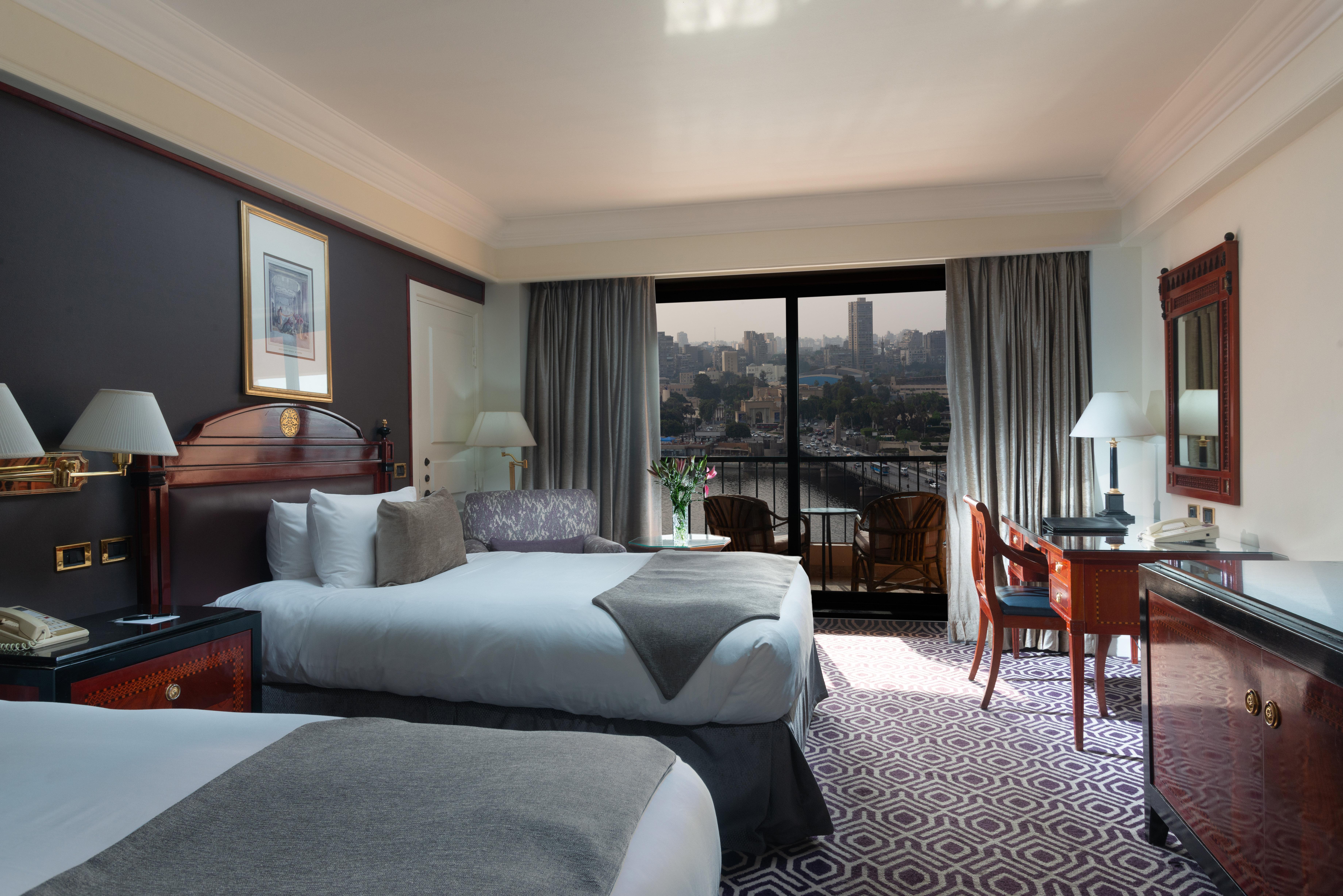 Intercontinental Cairo Semiramis By Ihg Hotel Kültér fotó A room at the Nile Ritz-Carlton